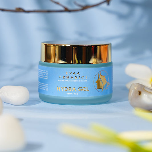 Jar of EYAA Organics Hydra Gel with flowers in the background